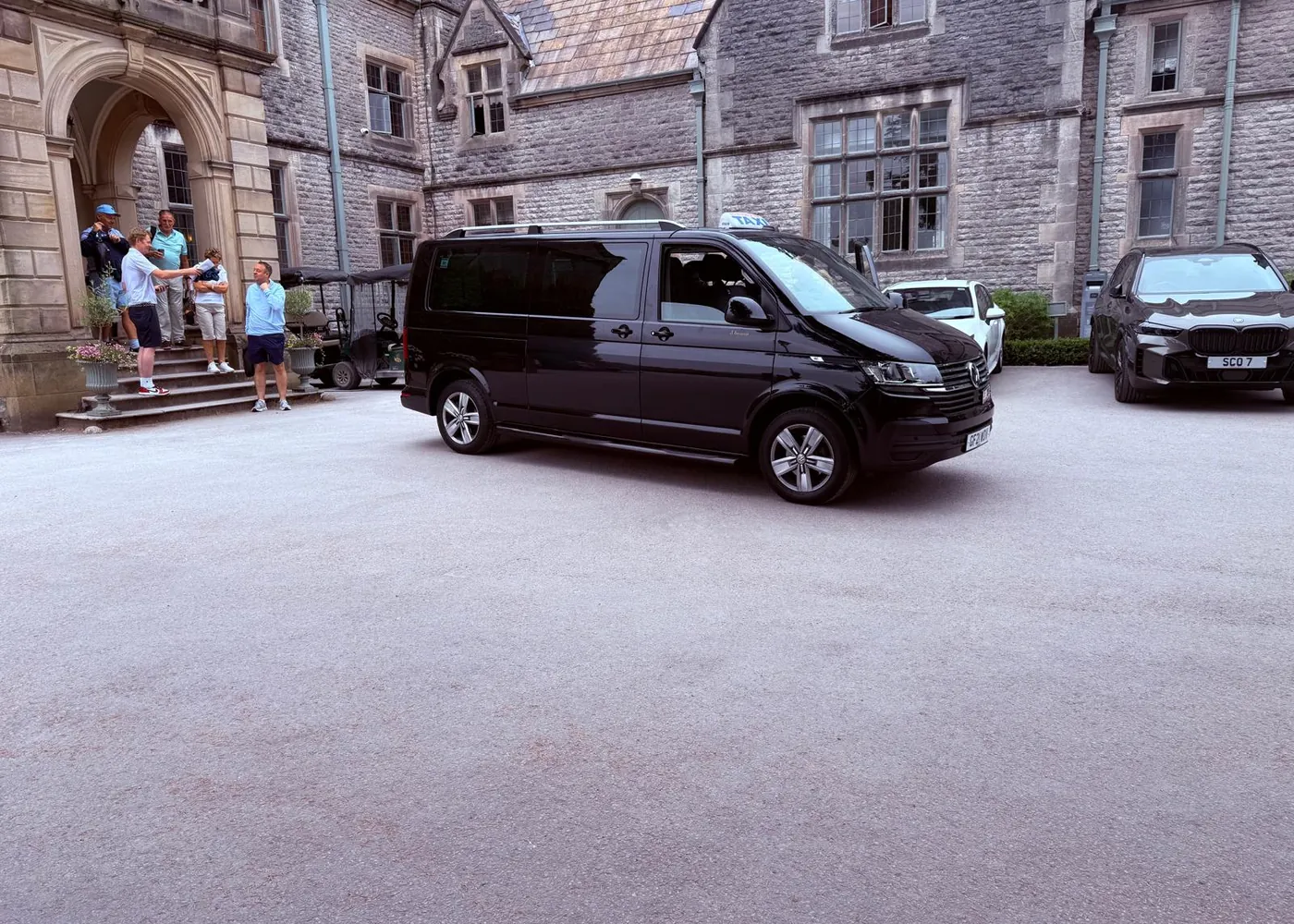 Executive minibus arriving at an event venue